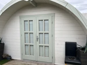 Log cabin home in Ireland built with Scandinavian pine, front view.